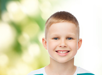 Image showing smiling little boy over green background