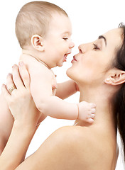 Image showing happy mother kissing baby