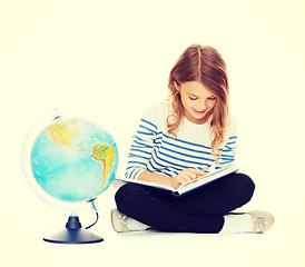 Image showing girl with globe and book