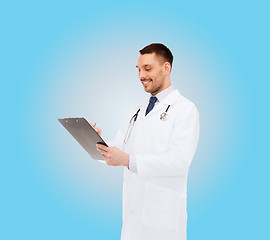 Image showing smiling male doctor with clipboard and stethoscope