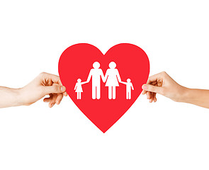 Image showing couple hands holding red heart with family