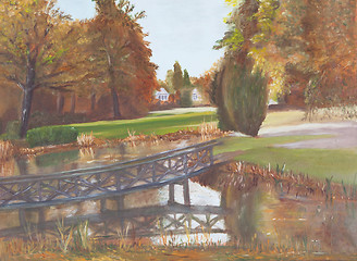 Image showing Autumn forest with a pond and bridge over the pond