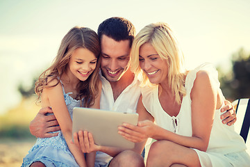 Image showing happy family with tablet pc taking picture