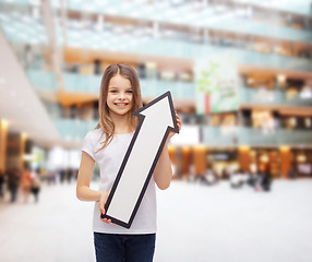 Image showing smiling little girl with blank arrow pointing up