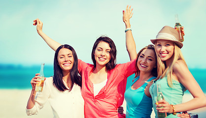 Image showing girls with drinks on the beach