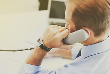 Image showing handsome businessman talking on the phone