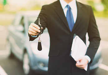 Image showing man with car key outside