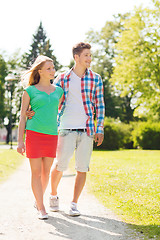 Image showing smiling couple walking in park