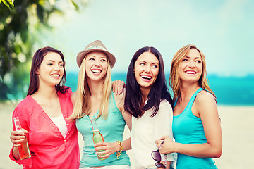 Image showing girls with drinks on the beach