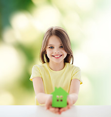 Image showing beautiful little girl holding paper house cutout