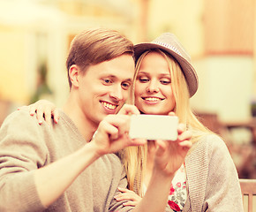 Image showing couple taking selfie with smartphone