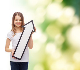 Image showing smiling little girl with blank arrow pointing up