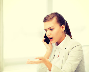 Image showing woman shouting into smartphone