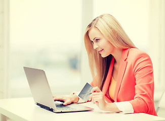 Image showing businesswoman with laptop and credit card