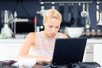 Image showing Business woman working from home.