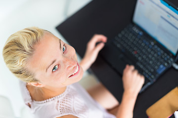 Image showing Business woman working from home.