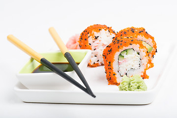 Image showing Chopsticks and sushi on the plate