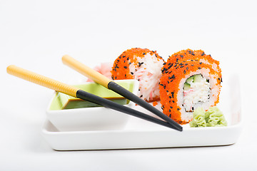 Image showing Rolls on the plate with chopsticks