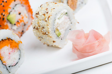 Image showing Ginger in focus and shushi on the background