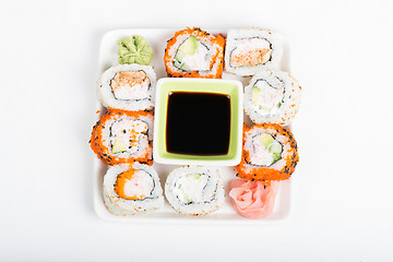 Image showing Different sorts of sushi on the plate, top view