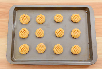 Image showing Balls of biscuit dough marked with a fork