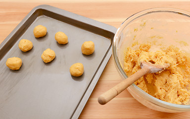 Image showing Balls of cookie dough on a baking sheet 