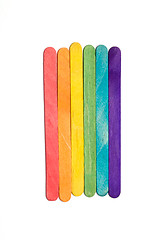 Image showing row of rainbow popsicle sticks