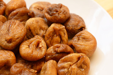 Image showing Soft dried figs on a white plate
