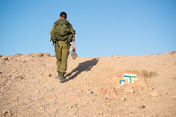 Image showing Soldiers patrol in desert