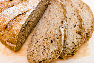 Image showing Sliced rye bread on a wooden board