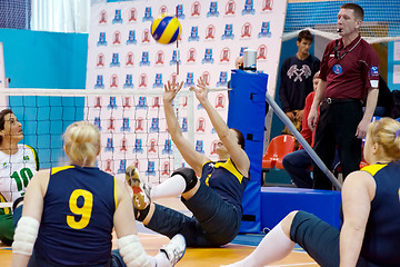 Image showing RUSSIA, MOSCOW - MAY 11: Angela Churkina (2) atack on International Sitting volleyball tournament game Ukraine vs Brazil on May 11, 2014, in Moscow, stadium CSP Izmailovo, Russia