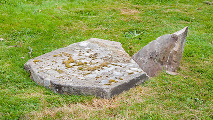 Image showing Very old broken gravestone in the cemetery