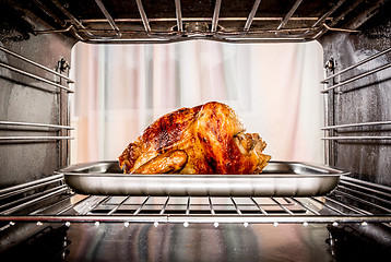 Image showing Roast chicken in the oven.