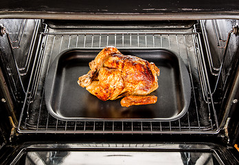 Image showing Roast chicken in the oven.