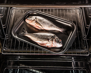Image showing Dorado fish in the oven.