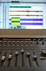 Image showing Professional audio mixer with sliders and sound waves