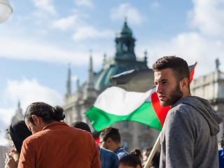 Image showing Face of a young activist on the background of the Palestinian fl