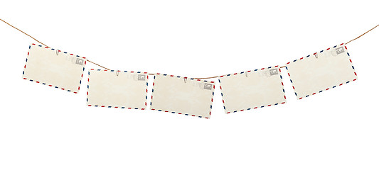 Image showing Post cards hanging on a rope