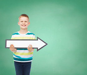 Image showing smiling little boy with blank arrow pointing right