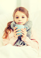 Image showing ill girl child with cup of hot tea