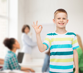 Image showing little boy in casual clothes making ok gesture