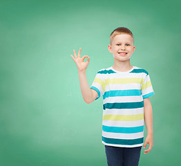 Image showing little boy in casual clothes making OK gesture