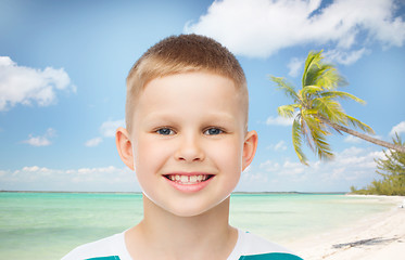 Image showing smiling little boy over green background