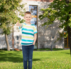 Image showing smiling little boy showing thumbs up