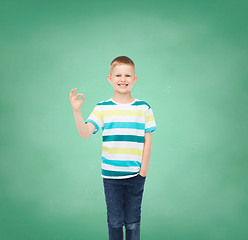 Image showing little boy in casual clothes making OK gesture