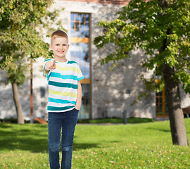 Image showing smiling little boy pointing finger at you