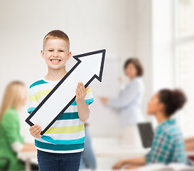 Image showing smiling little boy with blank arrow pointing right