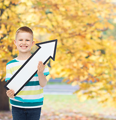 Image showing smiling little boy with blank arrow pointing right