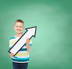 Image showing smiling little boy with blank arrow pointing right