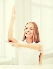 Image showing student girl with hand up at school
